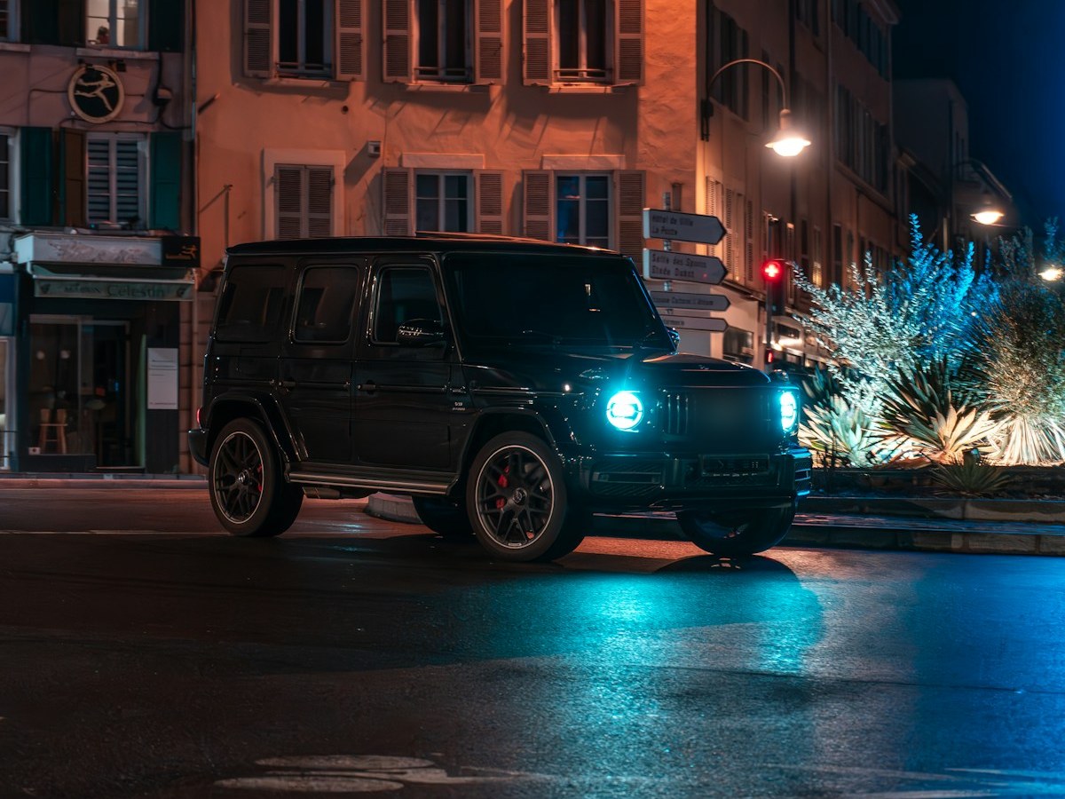 Black luxury SUV at night